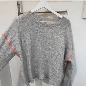 Gray crewneck sweater with cute neon orange stitching detail
